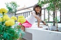 Asian toddler gardening at home Royalty Free Stock Photo