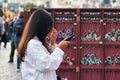 Asian tourist in front of a souvenir stand in Prague