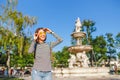 Tourist girl with backpack in front of the Fountain in Budapest