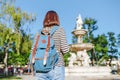 tourist girl with backpack in front of the Fountain in Budapest