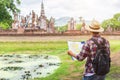Asian tourist man in Sukhothai historical park, Thailand
