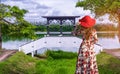 Asian tourist standing in Nong Han Pier. Near the lotus garden in Sakon Nakhon Province,Thailand Royalty Free Stock Photo