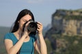 Asian tourist taking photos with dslr camera Royalty Free Stock Photo