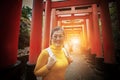 Asian tourist toothy smiling face in fushimi inari shrine one o