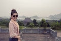 Asian tourist toothy smiling face happiness emotion in chua bai