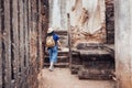 Asian tourist woman sightseeing in ancient of temple thai archit