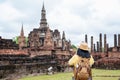 Asian tourist woman take a photo of ancient of pagoda temple thai architecture at Sukhothai Historical Park,Thailand. Female Royalty Free Stock Photo