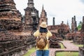 Asian tourist woman take a photo of ancient of pagoda temple thai architecture at Sukhothai Historical Park,Thailand. Female Royalty Free Stock Photo