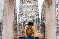 Asian tourist woman take a photo of ancient of pagoda temple thai architecture at Sukhothai,Thailand. Female traveler in casual t