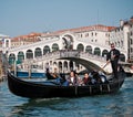 Asian tourists enjoy gondola trip, Venice, Italy