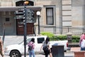 Asian tourists looking at landmark sign