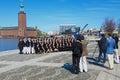 Asian tourists make group photo with the City Hall (Stadshuset) at the background in Stockholm, Sweden.