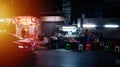 Asian tourists walking through Soi Cowboy at night time.