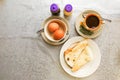 Asian traditional breakfast half boiled eggs, toast bread and co