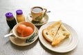 Asian traditional breakfast half boiled eggs, toast bread and co