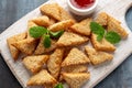 Asian Traditional Prawn Toast with Sesame seeds and sweet chilli sauce on wooden white board