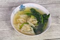 Asian traditional Wonton soup with herbs