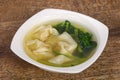 Asian traditional Wonton soup with herbs