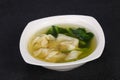 Asian traditional Wonton soup with herbs