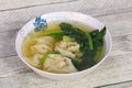 Asian traditional Wonton soup with herbs