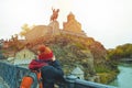 Asian travel backpacker lady in winter suit use camera take photo of Statue of King Vakhtang Gorgasali,one of travel destination