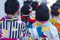 Asian Travel Destinations. Group of Female Geishas in Traditional Japanese Silk Kimono Walking on Street of Kyoto City, Japan