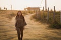 Asian travel woman walking on dirt road Royalty Free Stock Photo