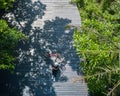 Asian traveler holiday relax with bicycle in nature park Royalty Free Stock Photo