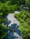 Asian traveler holiday relax with bicycle in nature park Royalty Free Stock Photo