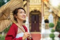 Asian traveler walking in old pavillion in Temple