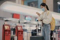 Asian travelers girl with medical face mask to protection the Covid-19 in airport