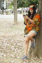 Asian travelers thai blogger shooting photo with Pink trumpet tree