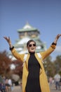 Asian traveling woman happiness emotion in front of osaka castle