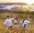 Asian traveller family walking on morning sunrise time togather