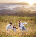 Asian traveller family walking on morning sunrise time togather