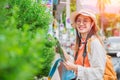 Asian traveller girl teen or Tourist happy smile travel in summer vacation with map walk at the street