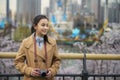 Asian traveller girl travel in seoul city with her digital camera Royalty Free Stock Photo