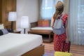 Asian traveller woman check in and open the door in Hotel room between her traveller trip