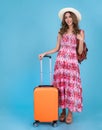 Asian traveller woman in red dress and travel bag