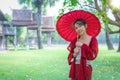 Asian traveller woman in traditional lanna dress in temple for take a photo in Chiang mai city