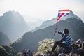 Asian trekking man holding Thailand flag Royalty Free Stock Photo