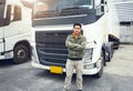 Asian Truck Driver Standing Cross One`s Arm with Semi Trailer Trucks. Lorry Driver. Cargo Shipping Freight Truck Transport.