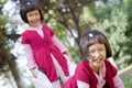 Asian twin girls playing