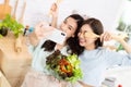 Asian two women wearing sportswear eat healthy foods in kitchen. Young beautiful girl happy and enjoy eating fruits healthy Royalty Free Stock Photo