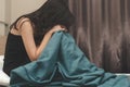 Asian tyoung woman feeling depressed and lonely in the house. Have acopy space for text