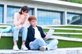 Asian university students use laptops to study and prepare for exams. Royalty Free Stock Photo