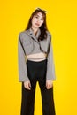 Asian urban trendy modern fashionable long hair female hipster teen model in casual street wears crop top shirt standing posing on Royalty Free Stock Photo