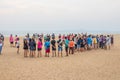 Asian vacationers or day trippers doing their activities on the beach Royalty Free Stock Photo