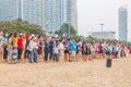 Asian vacationers or day trippers doing their activities on the beach Royalty Free Stock Photo