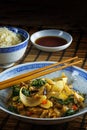 Asian vegetable dish with chopsticks on a bamboo mat, rice and s Royalty Free Stock Photo